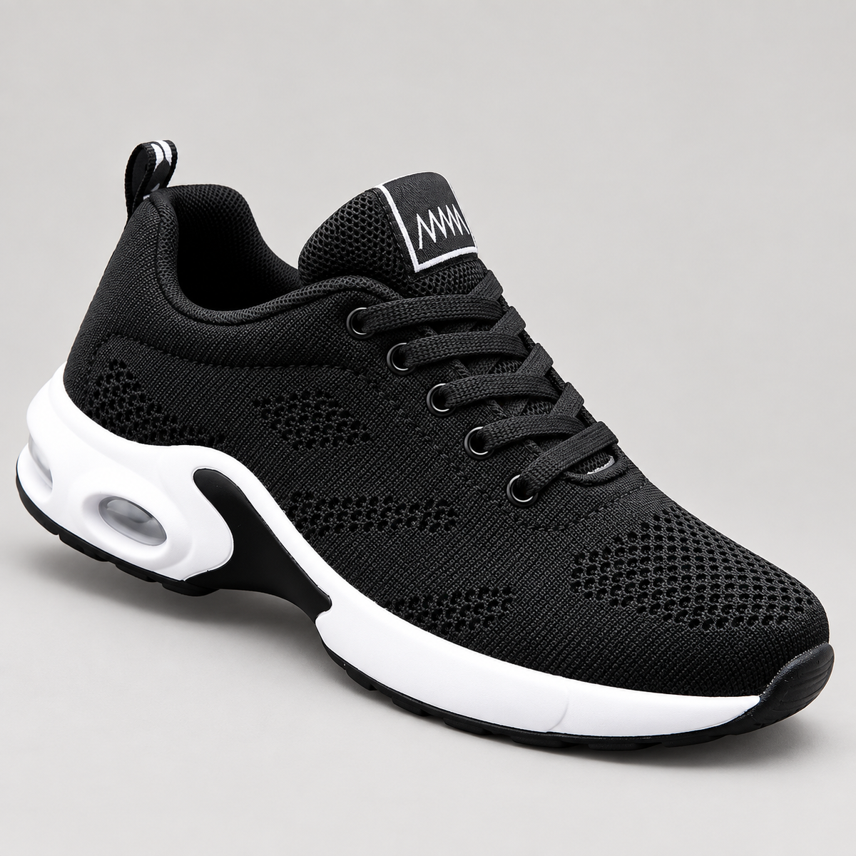 Cloudstep Pro black and white shoes - studio side view | OrthoKicks