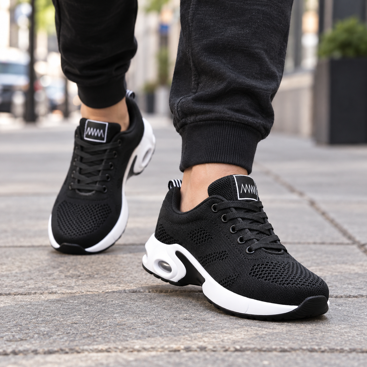 Cloudstep Pro black and white shoes - worn on feet, cropped below the waist | OrthoKicks